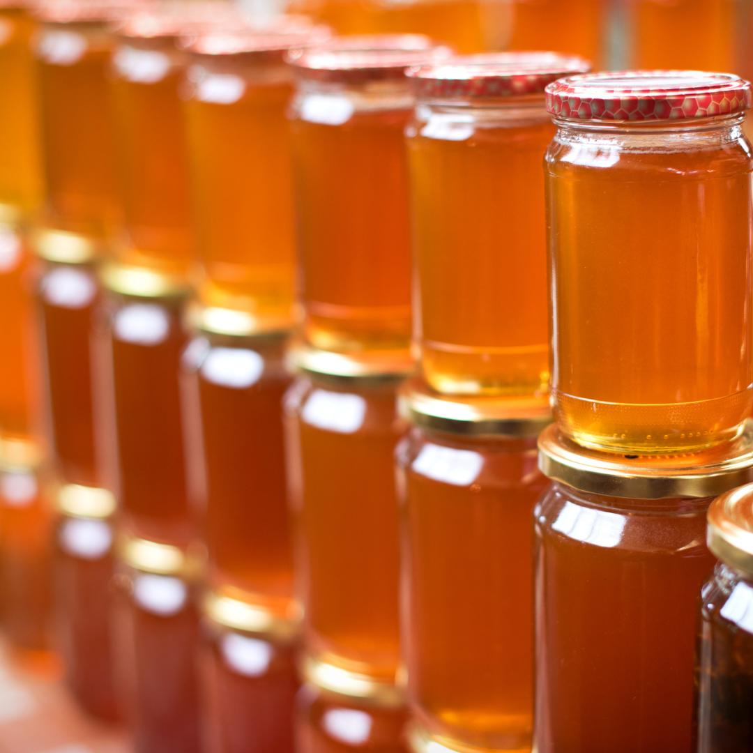 stacked jars of golden honey