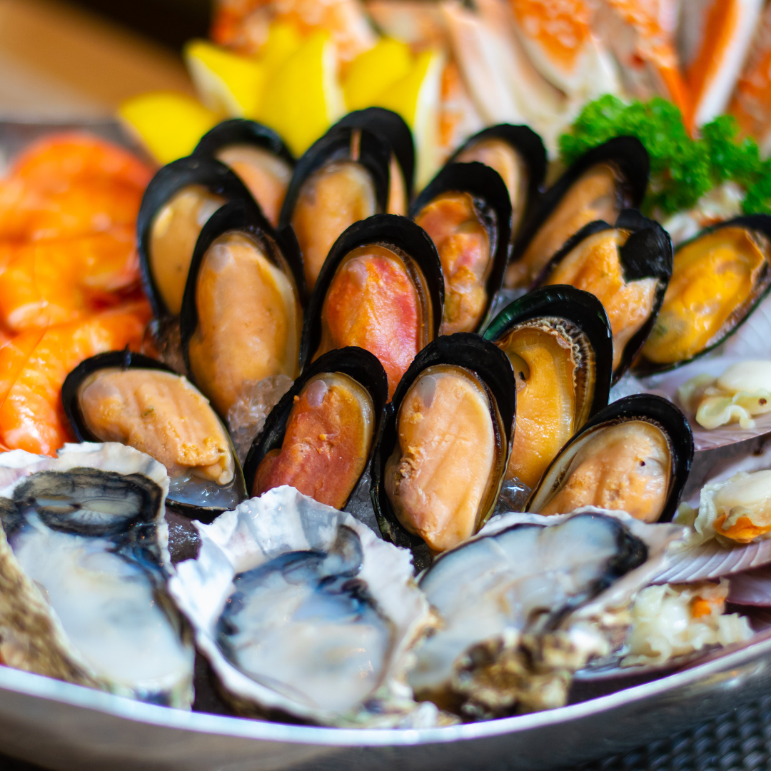 oysters, clams, and other seafood on a platter
